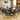 Quatropi Large Elm Round 1.6 Dining Table + 8 Bronze Brown Swivel Carver Chairs