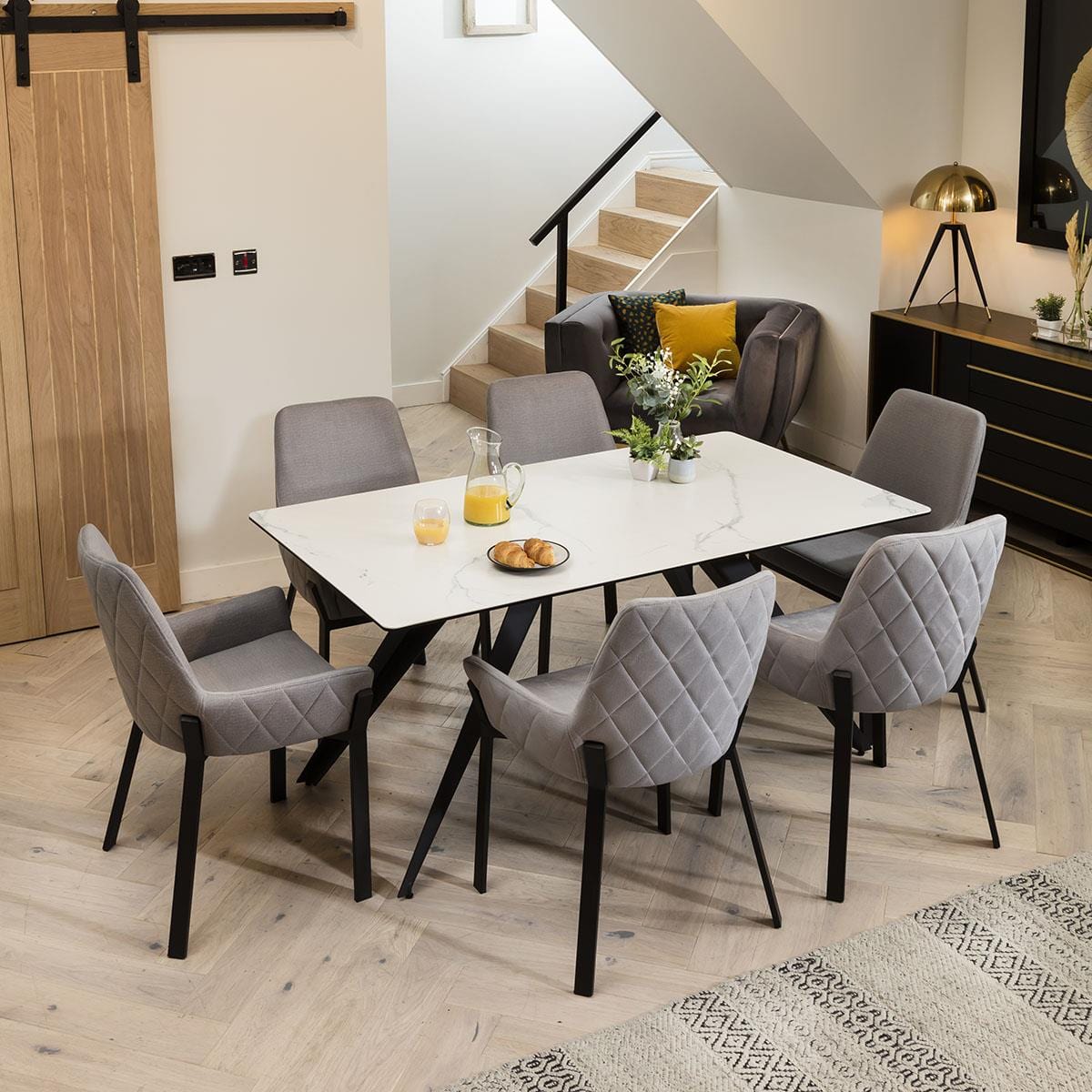 Quatropi Luxurious White Ceramic Table With 6 Exclusive Grey Carver Chairs