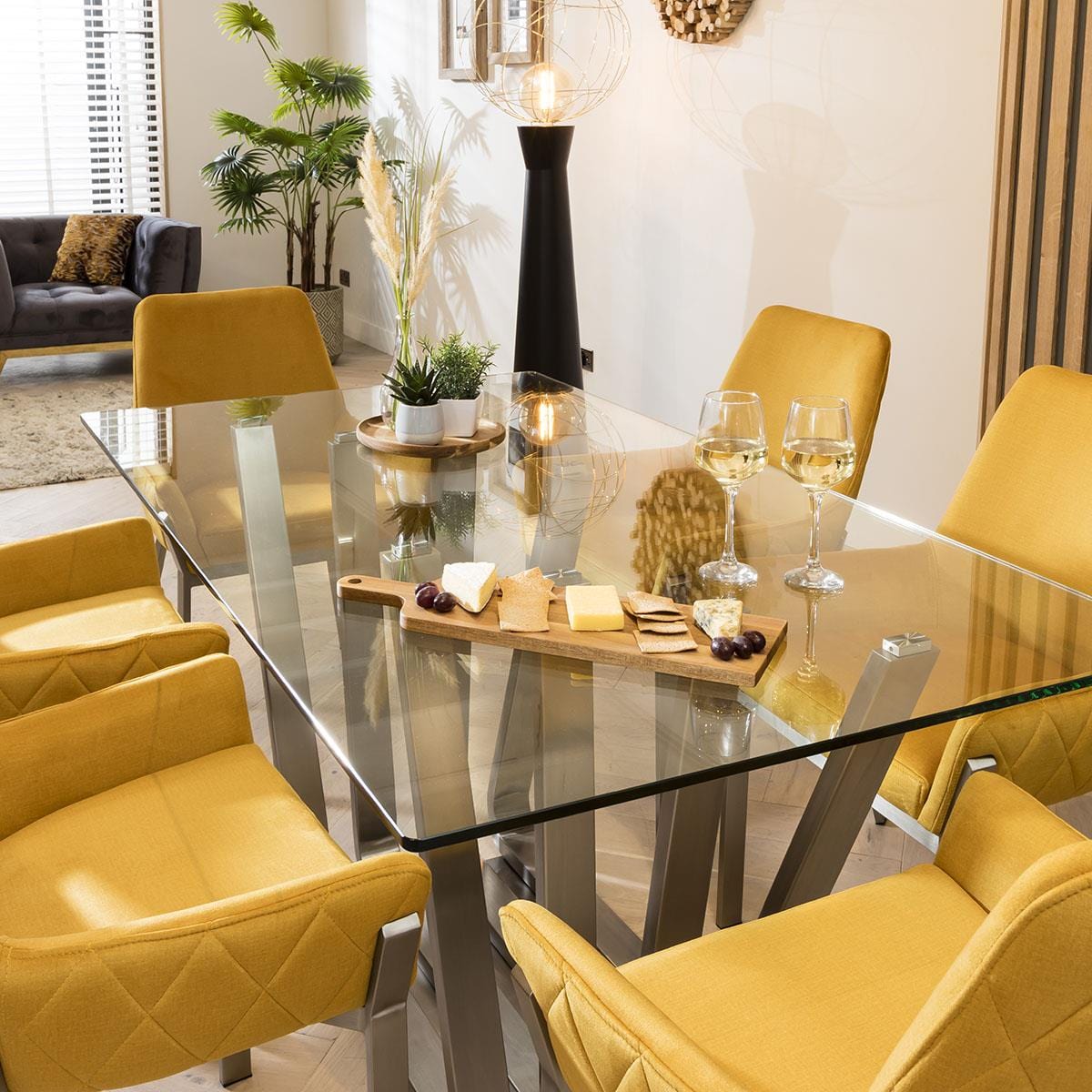 Quatropi Clear Glass Silver Pedestal Table With 6 Exclusive Yellow Carver Chairs